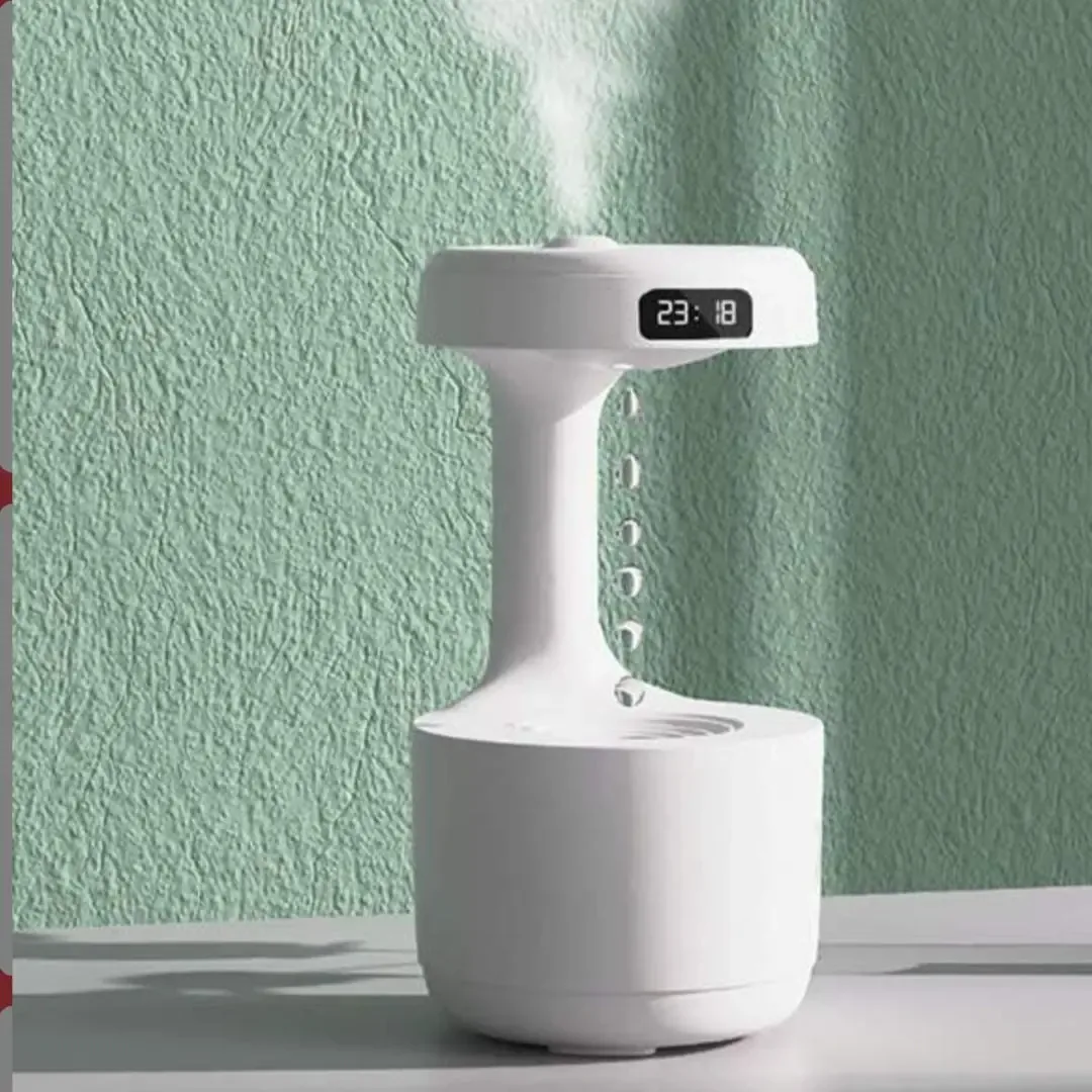 Humidificador antigravedad con reloj digital echando vapor