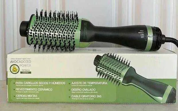 Cepillo secador alisador de 2000 W sobre su caja