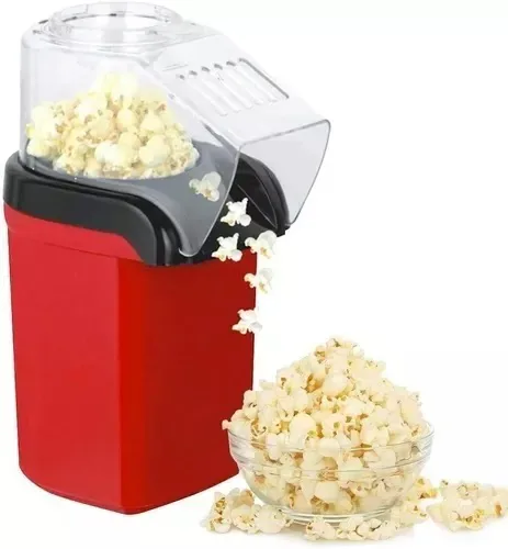 Máquina de crispetas sirviendo crispetas en un recipiente de vidrio