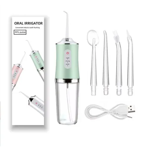 Irrigador bucal verde con su caja, 4 boquillas y cable USB